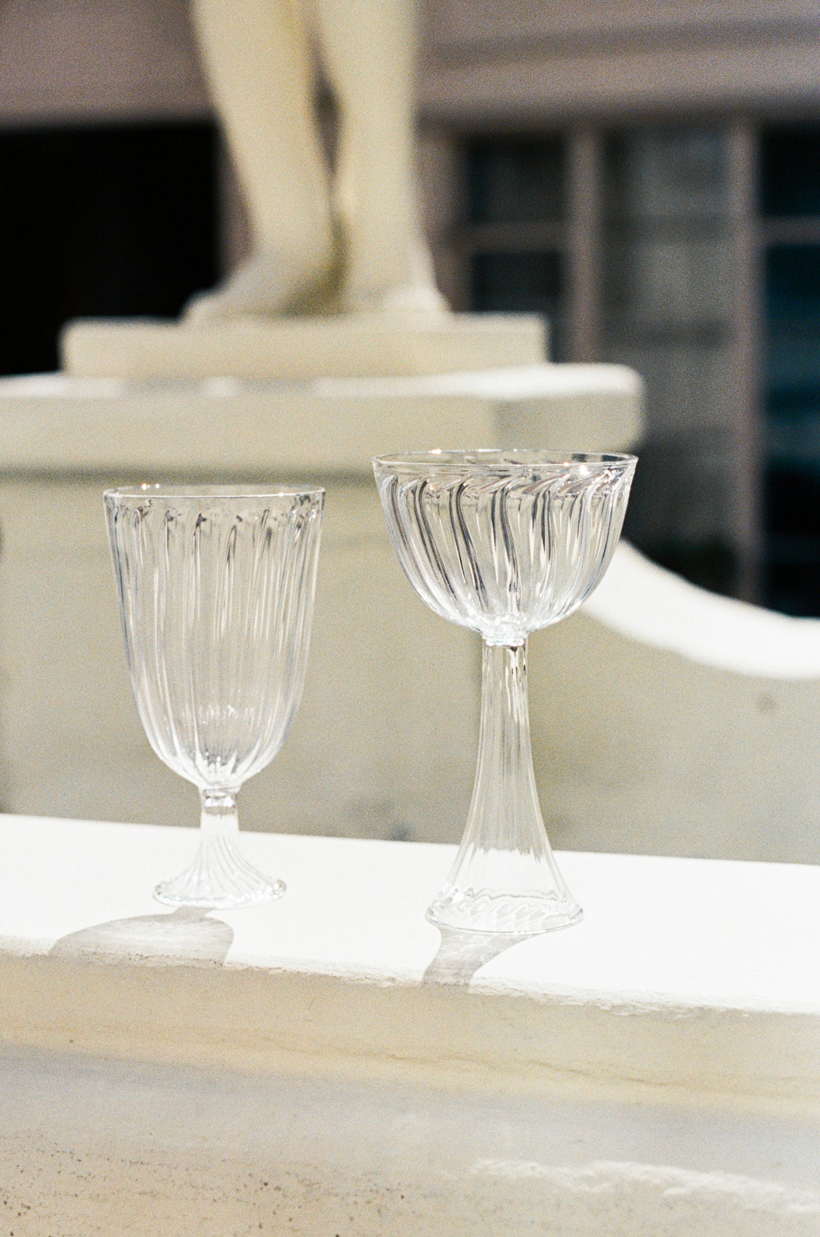 Ribbed champagne coupe and wine glass.