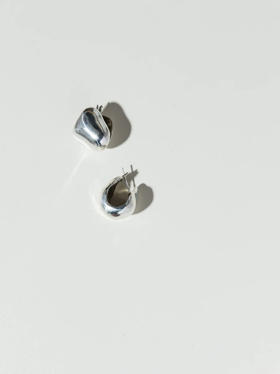 Women's sterling silver thick earrings with an organic form.