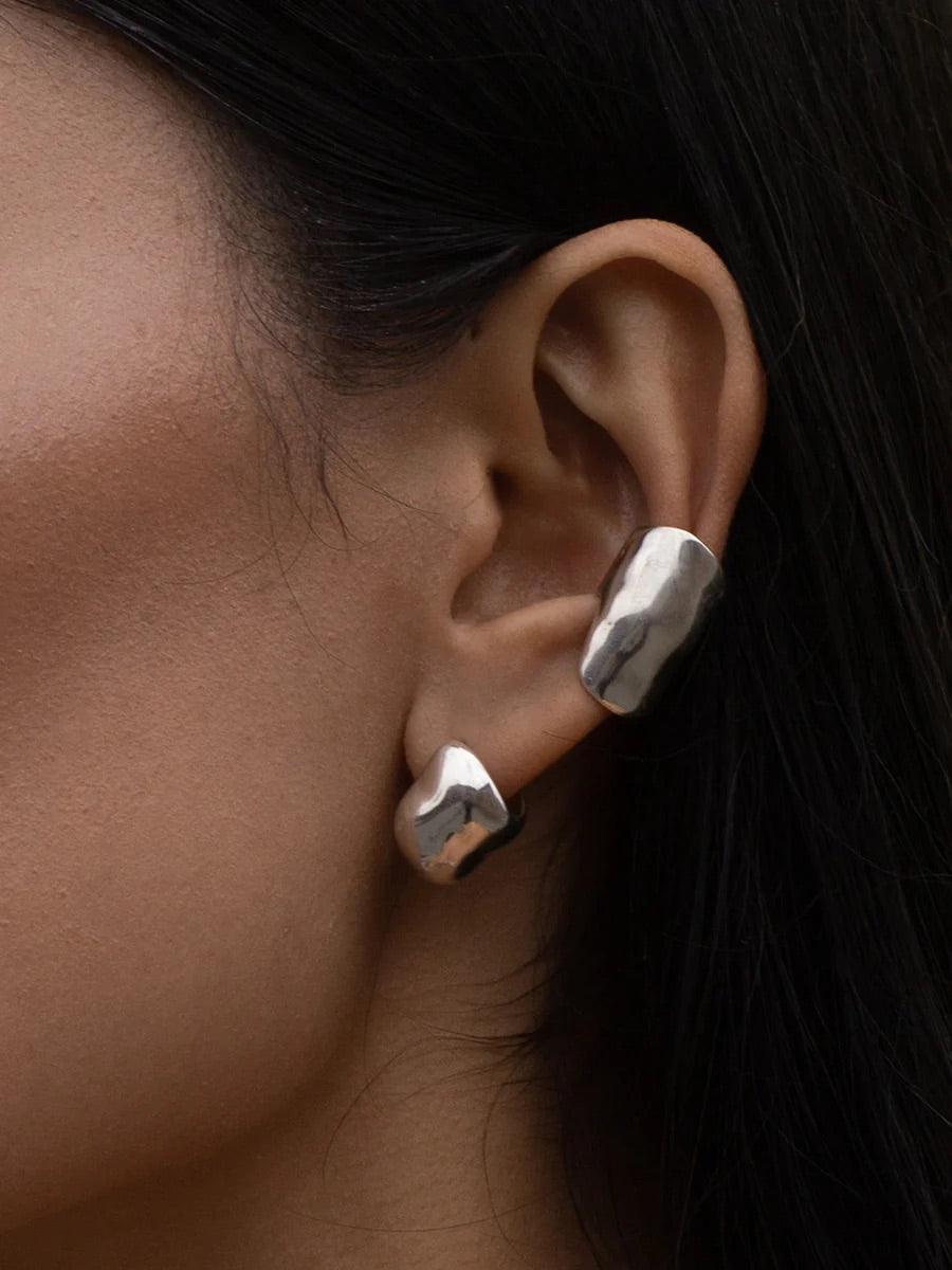 Women's sterling silver thick earrings with an organic form.