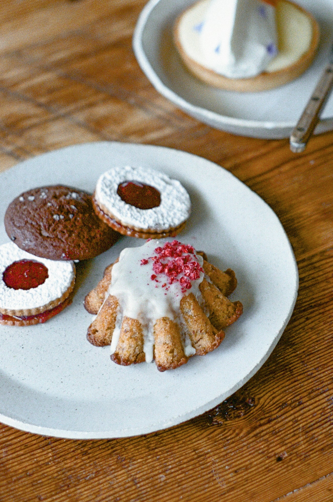 White ceramic plate with pastries.