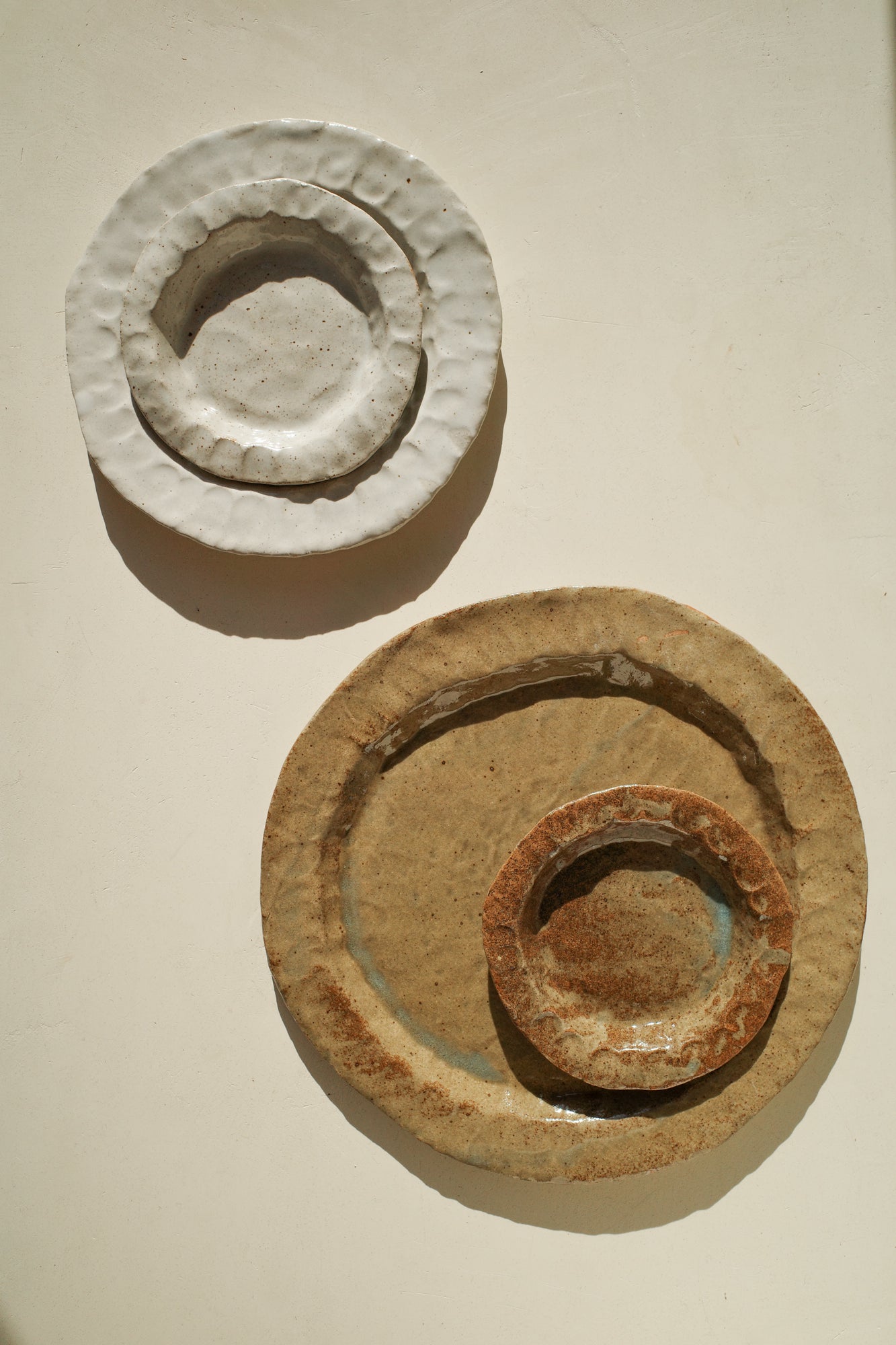 Handmade ceramic plates in varying sizes and glaze.