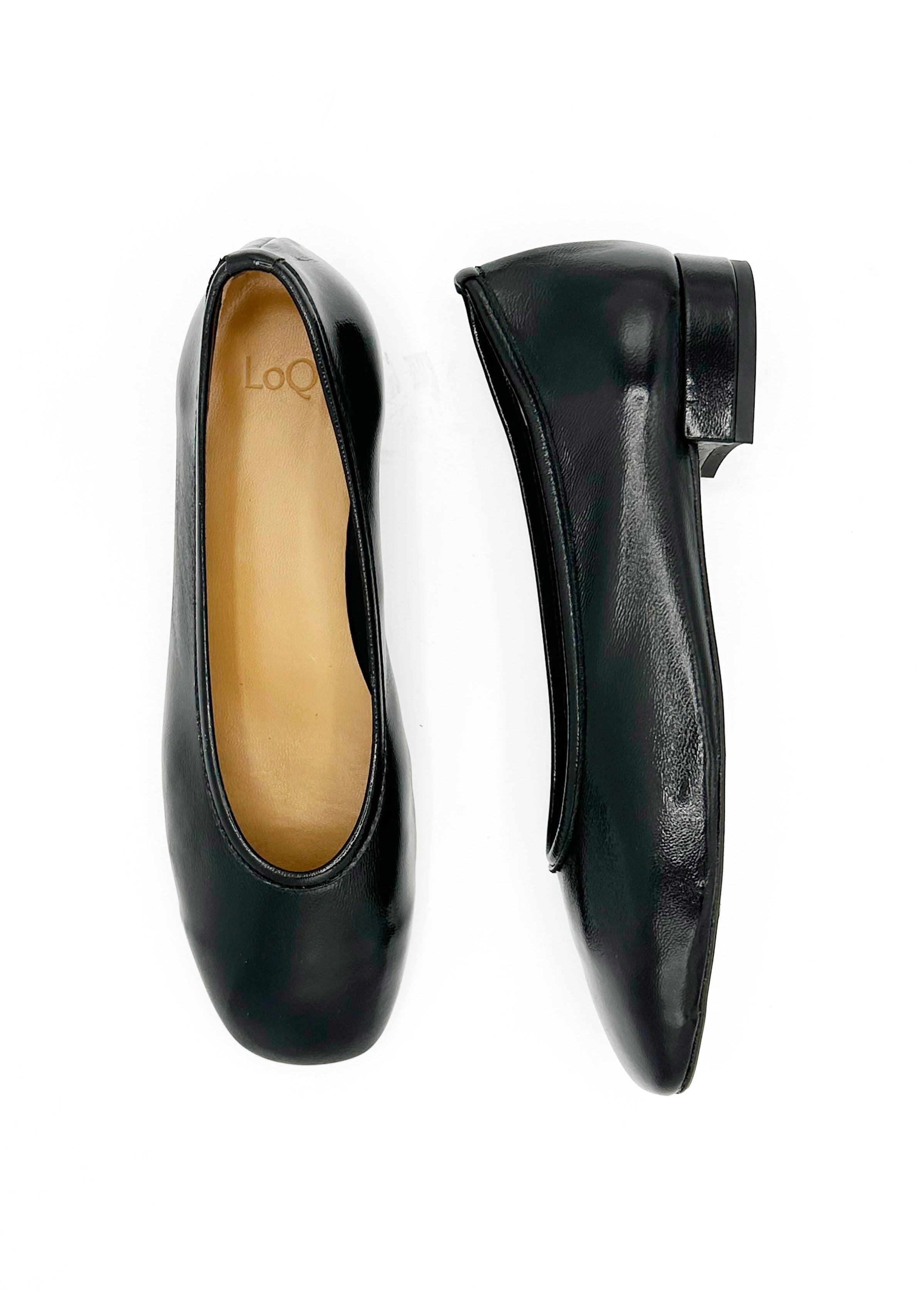 A pair of black leather ballet flats shown from top and side views on a plain white background. The brand name 'LoQ' is visible on the tan insole of the left shoe.