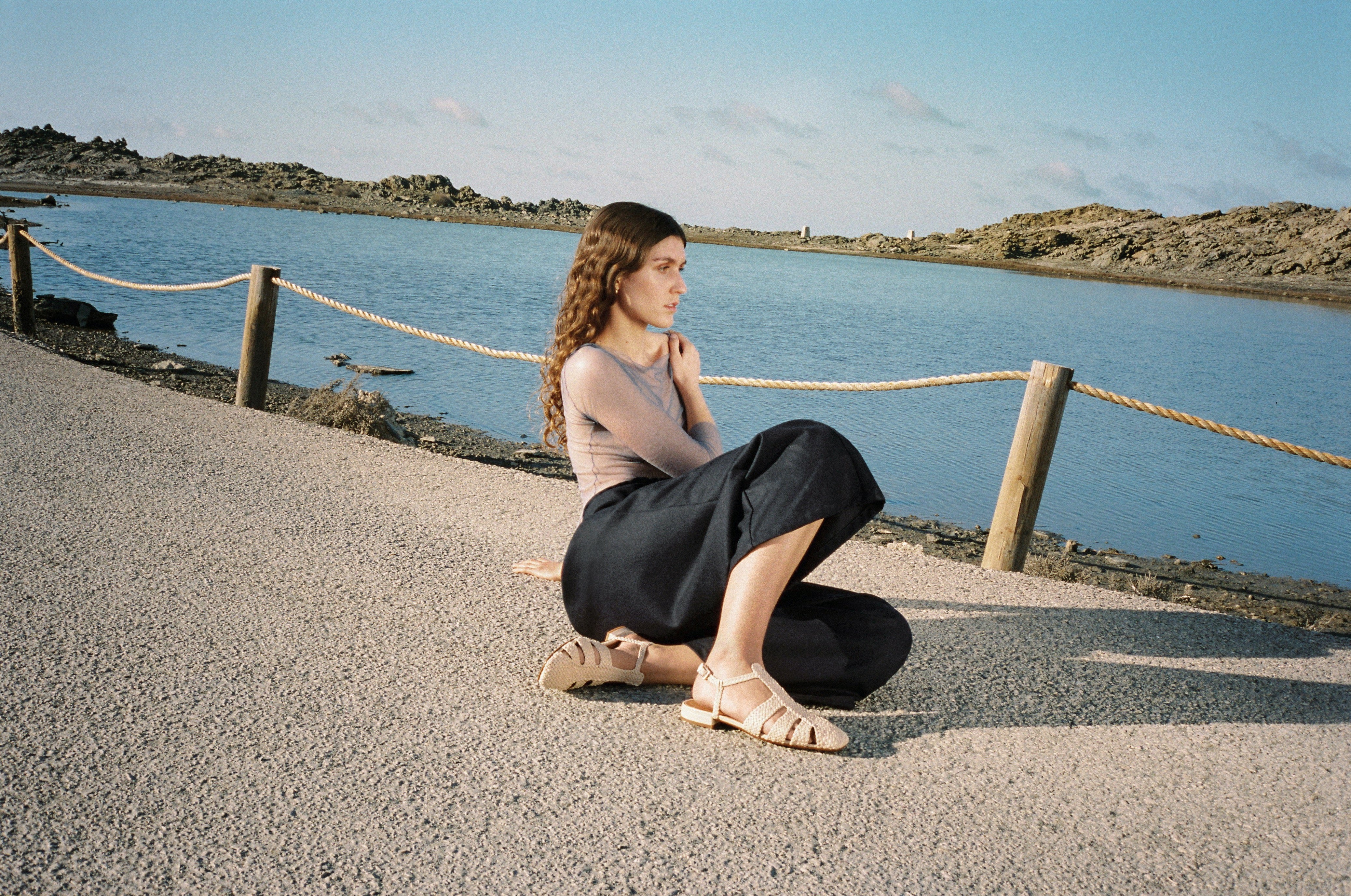 Fisherman-style sandals featuring straps made of woven leather across the foot and a strap that buckles around the ankle