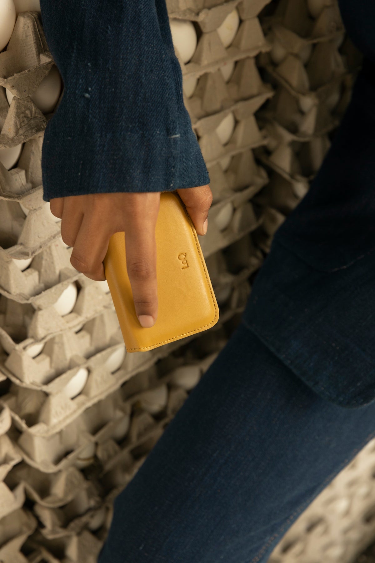 Yellow, card-sized wallet with envelope-style semicircle flap.