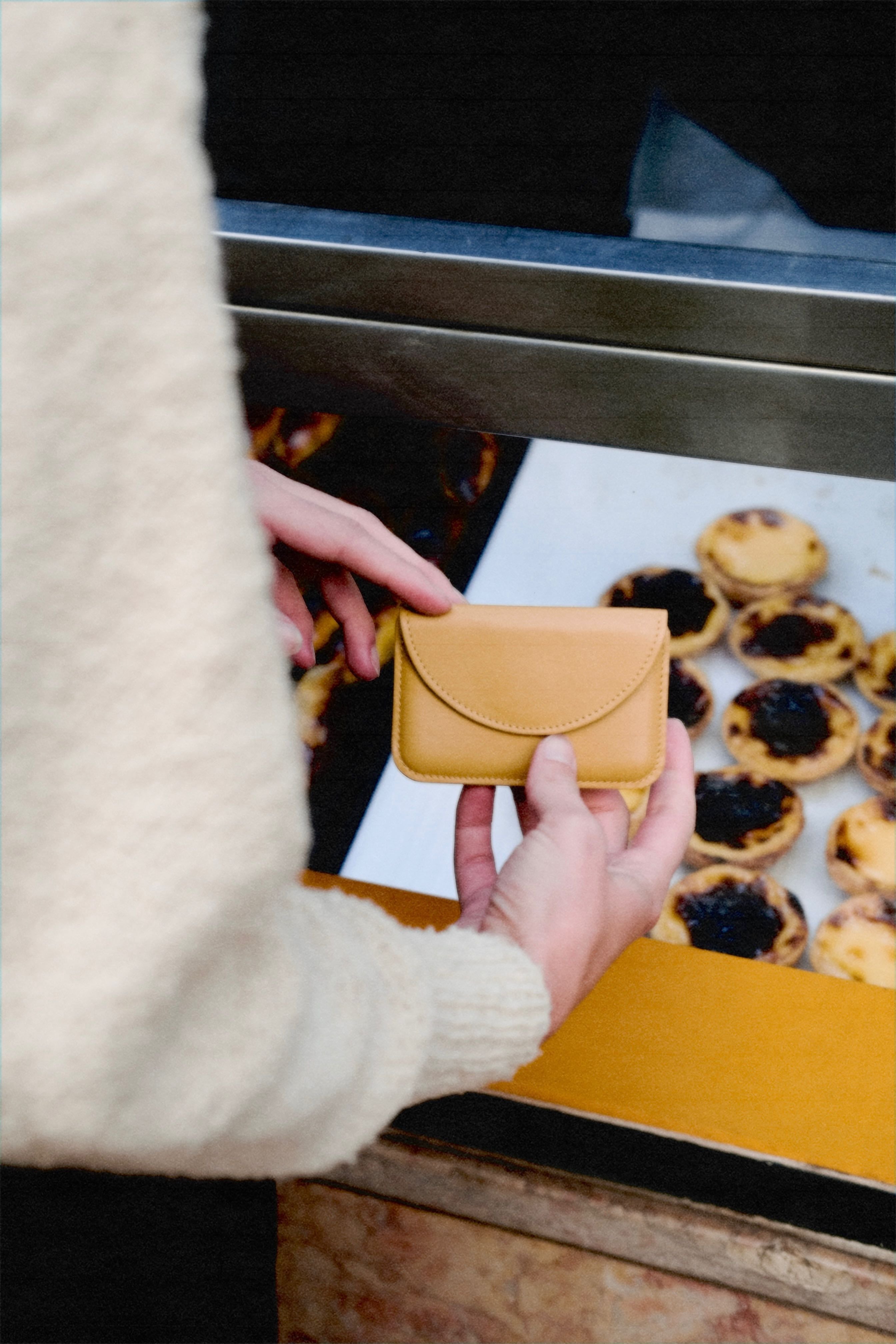 Yellow, card-sized wallet with envelope-style semicircle flap.