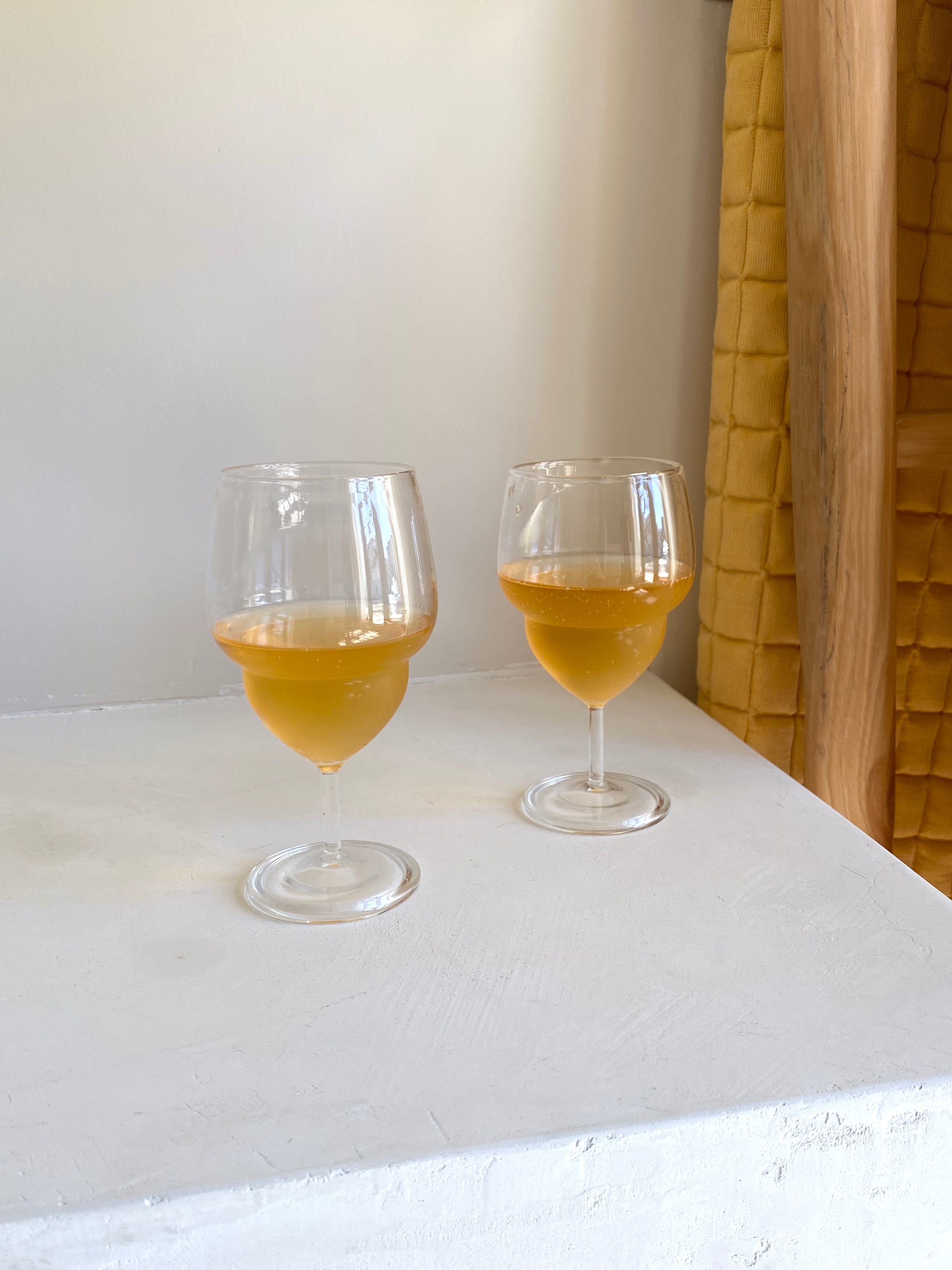 Unique, handblown curvy wine glass.