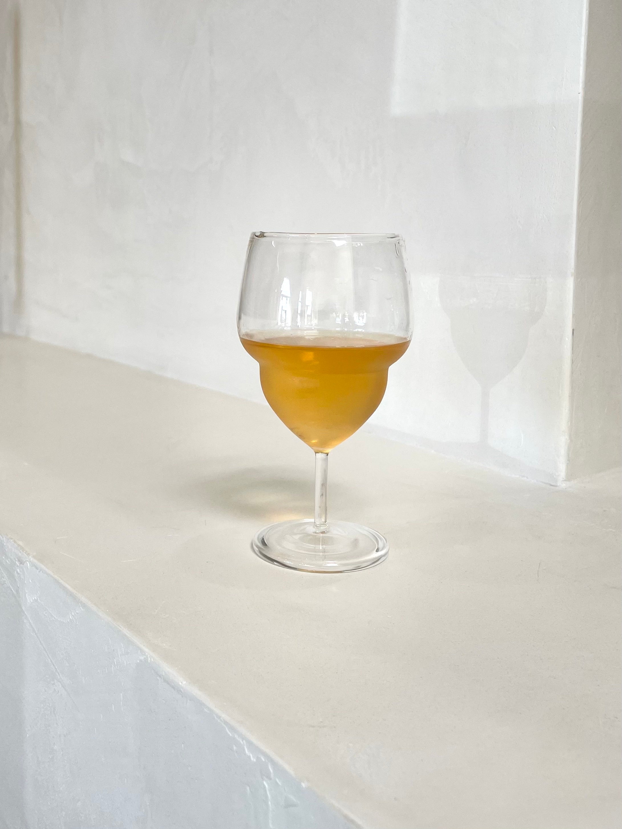 Unique, handblown curvy wine glass.
