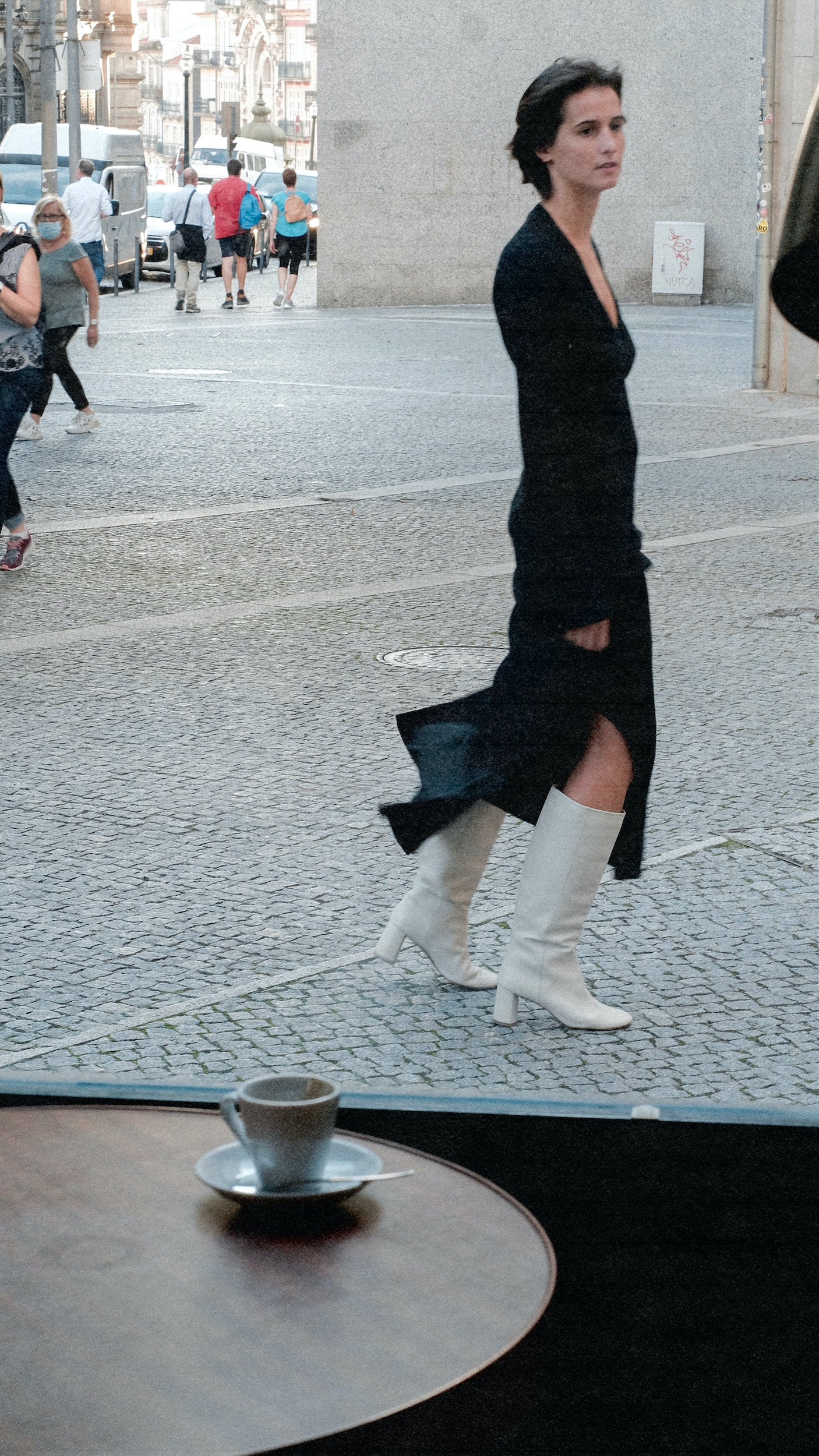 Tall pull-on boot in a supple cream, off-white leather that sits below the knee with a round toe