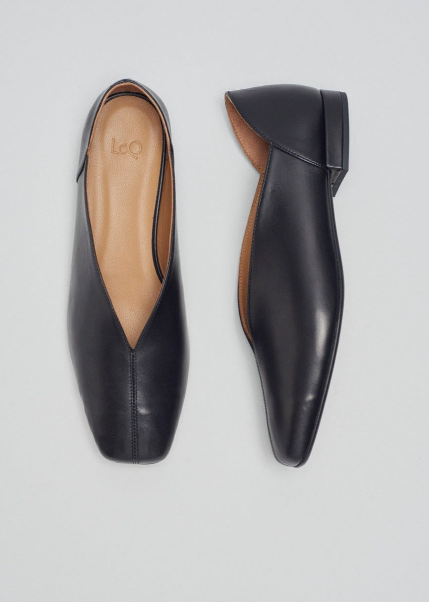 Black leather flats with a tulip shaped upper.