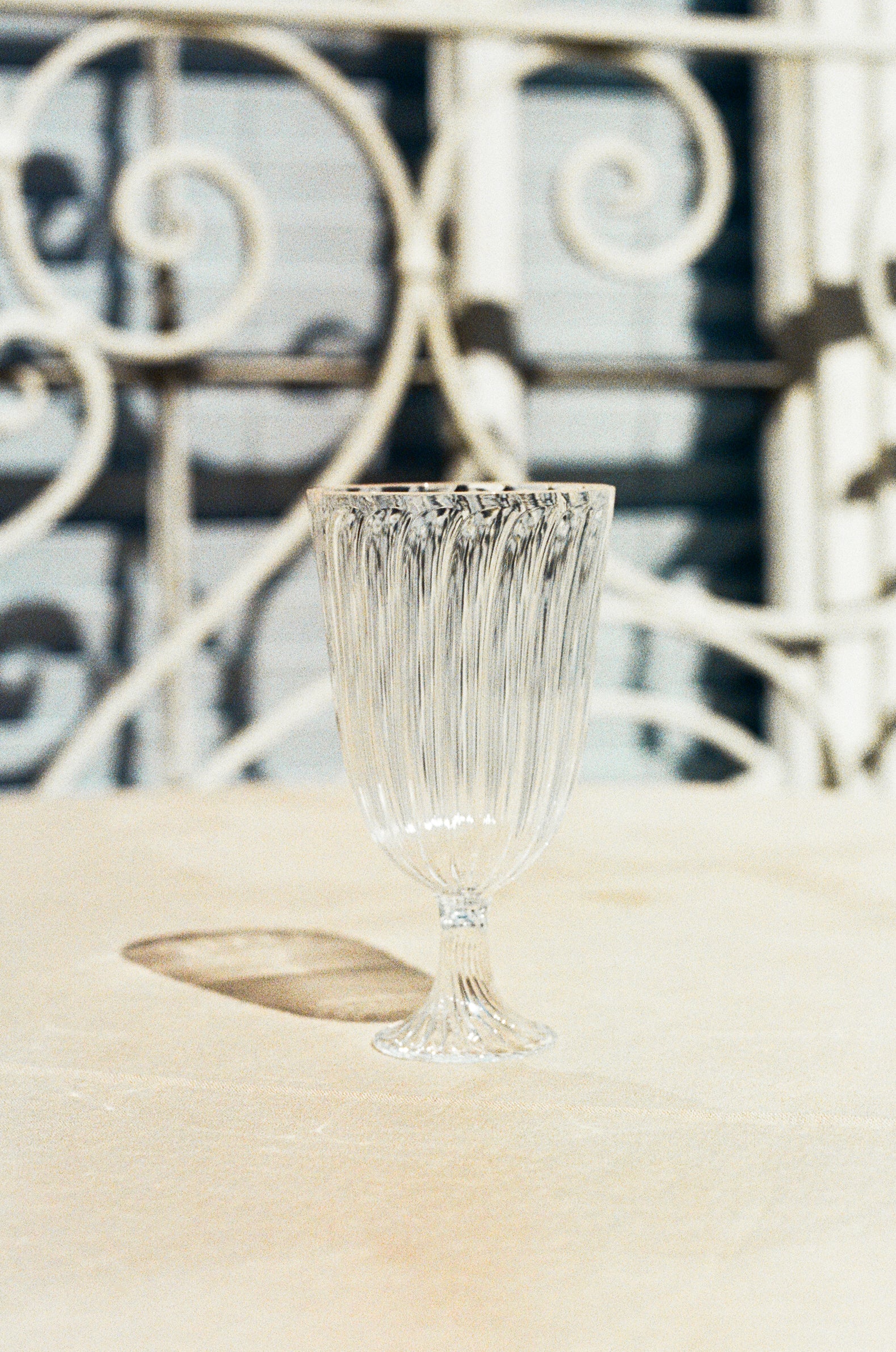 Ribbed wine glass.