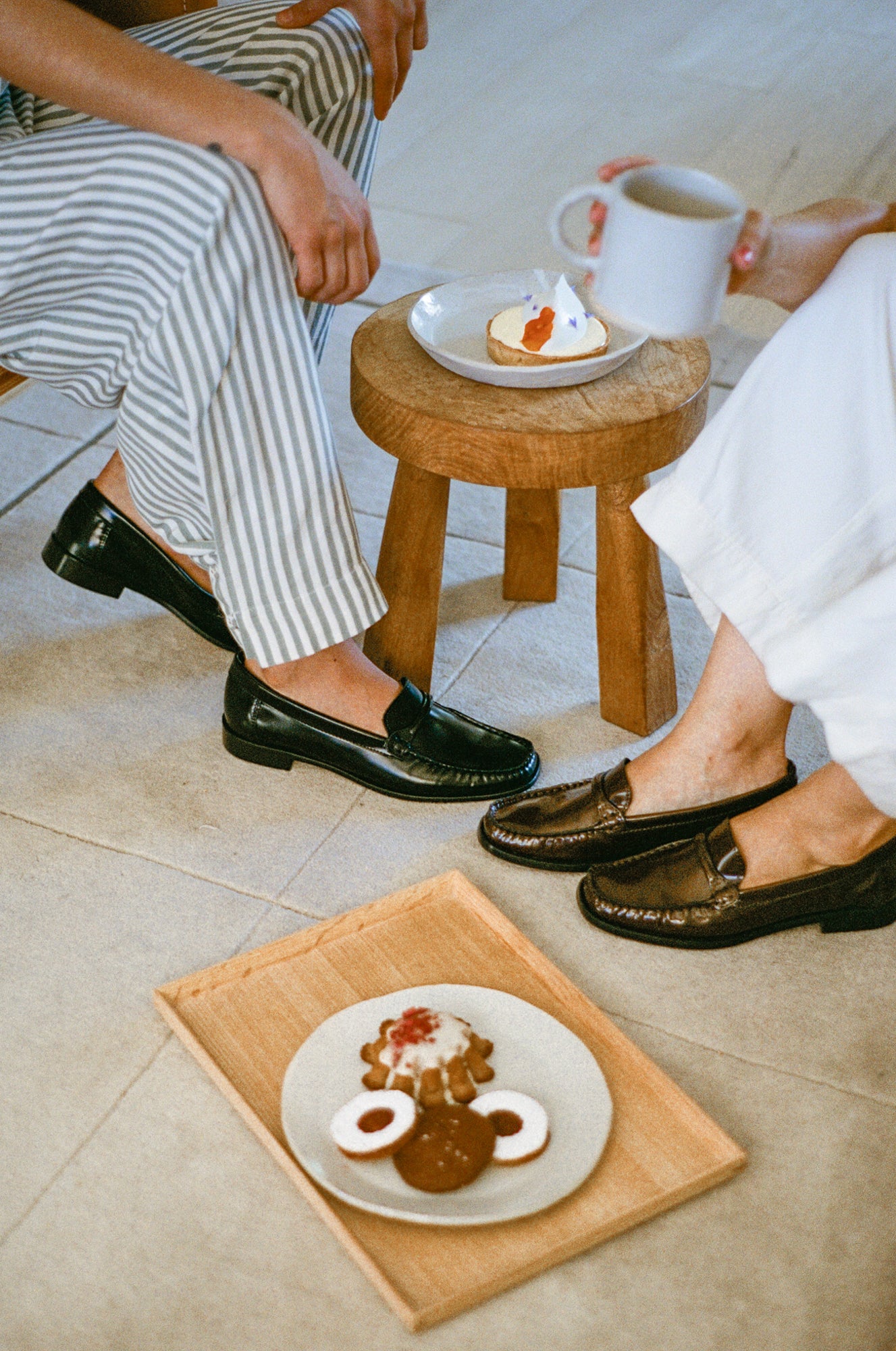 Model wears loafer in black smooth leather.