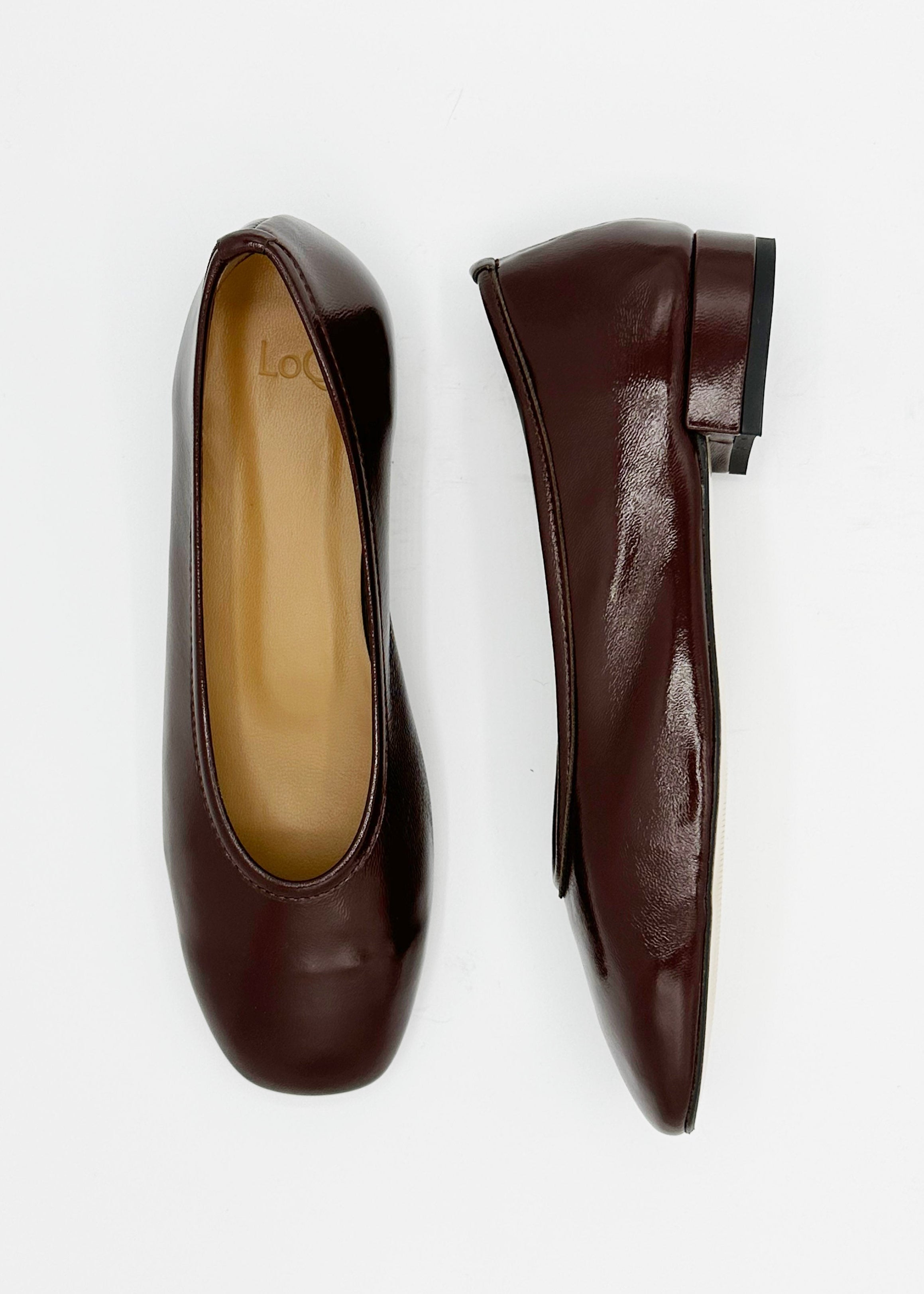 A pair of dark burgundy leather ballet flats shown from top and side views on a clean white background.