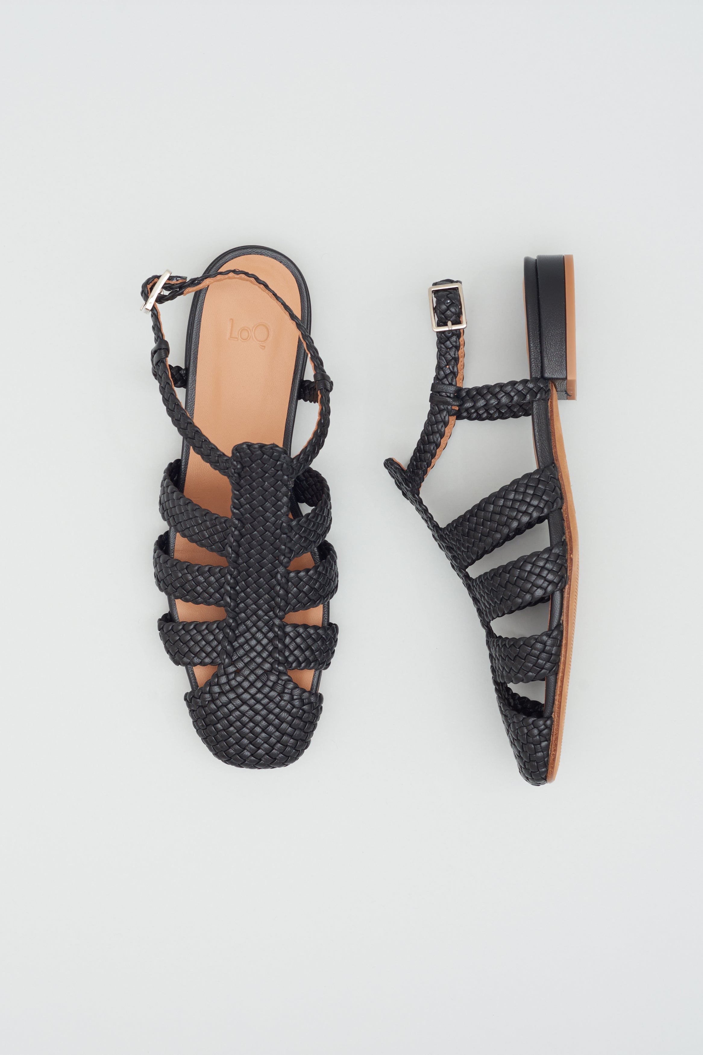 Fisherman-style sandals featuring straps made of woven leather across the foot and a strap that buckles around the ankle