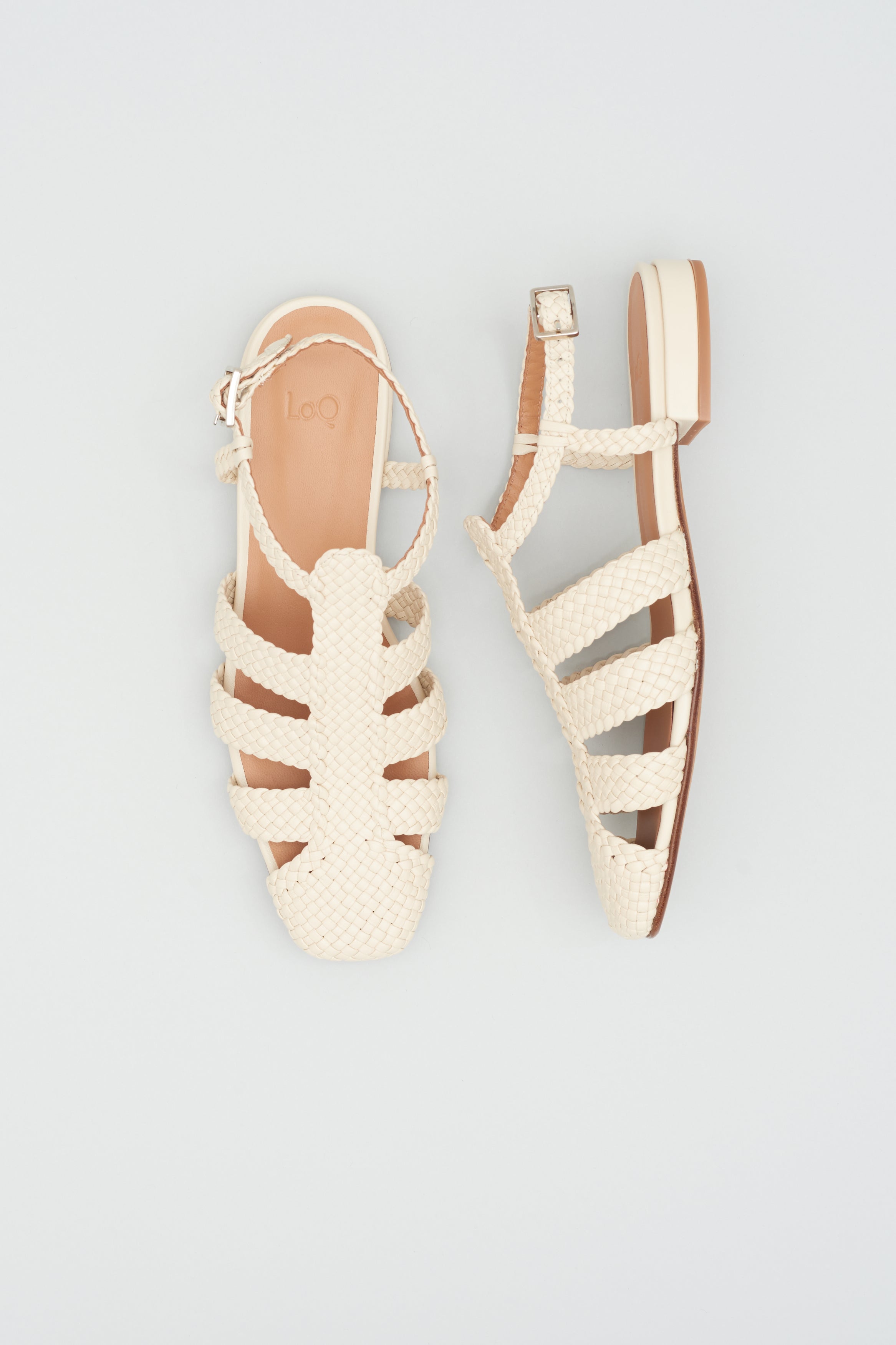 Fisherman-style sandals featuring straps made of woven leather across the foot and a strap that buckles around the ankle