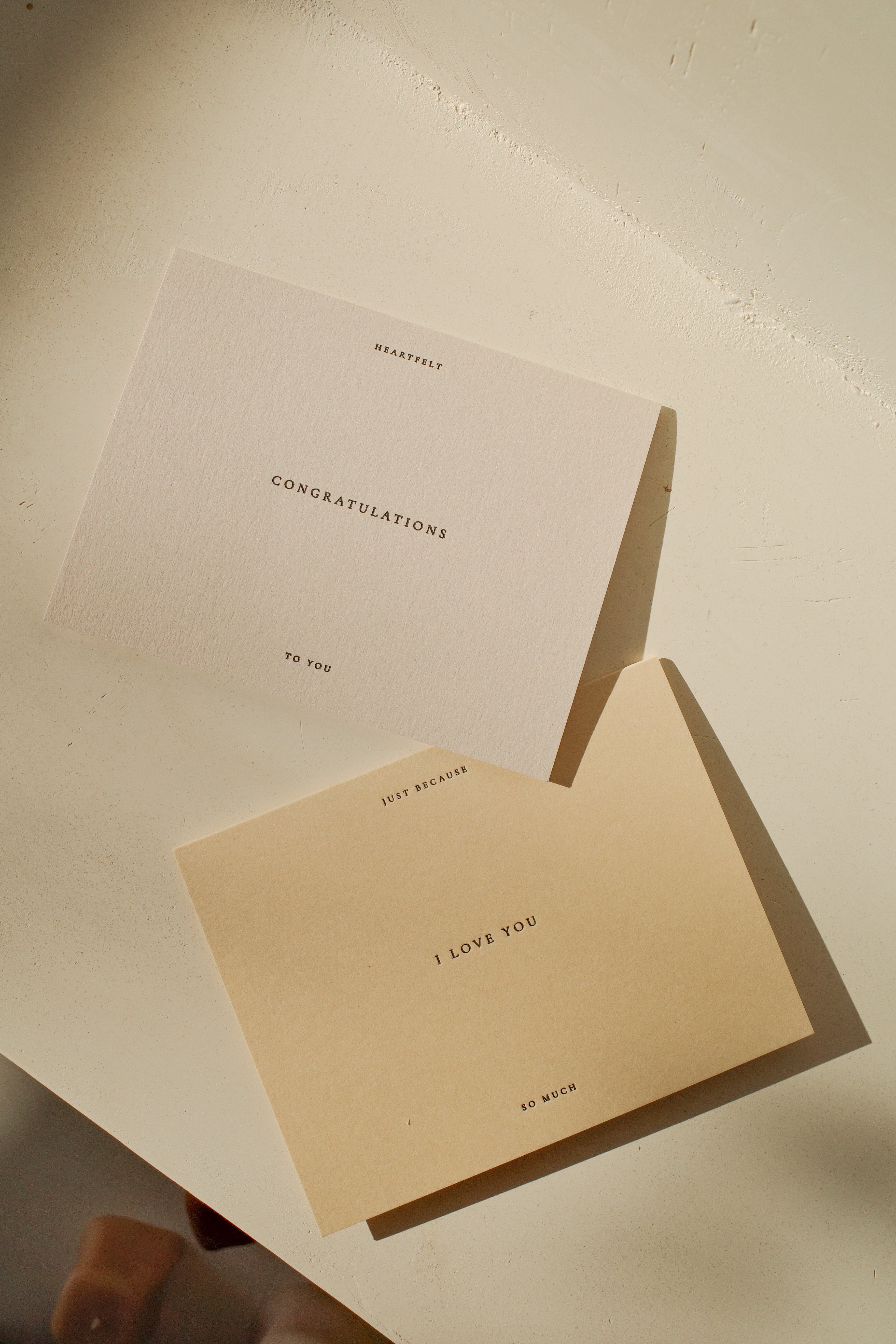 Off white greeting card that reads Just Because I Love You So Much next to Congratulations Card.